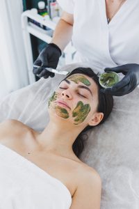 a-cosmetologist-applies-a-medical-mask-to-the-skin-6ZFBB4Q.jpg